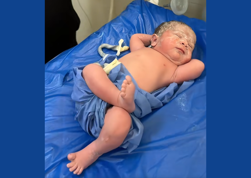 Newborn celebrated on social media for relaxed pose after delivery