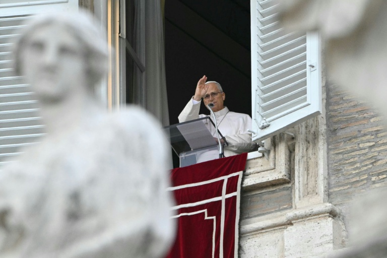 Resolved to resume working "gradually" after surgery, the pope blesses the crowd from the window of the apostolic palace overlooking St. Peter's square