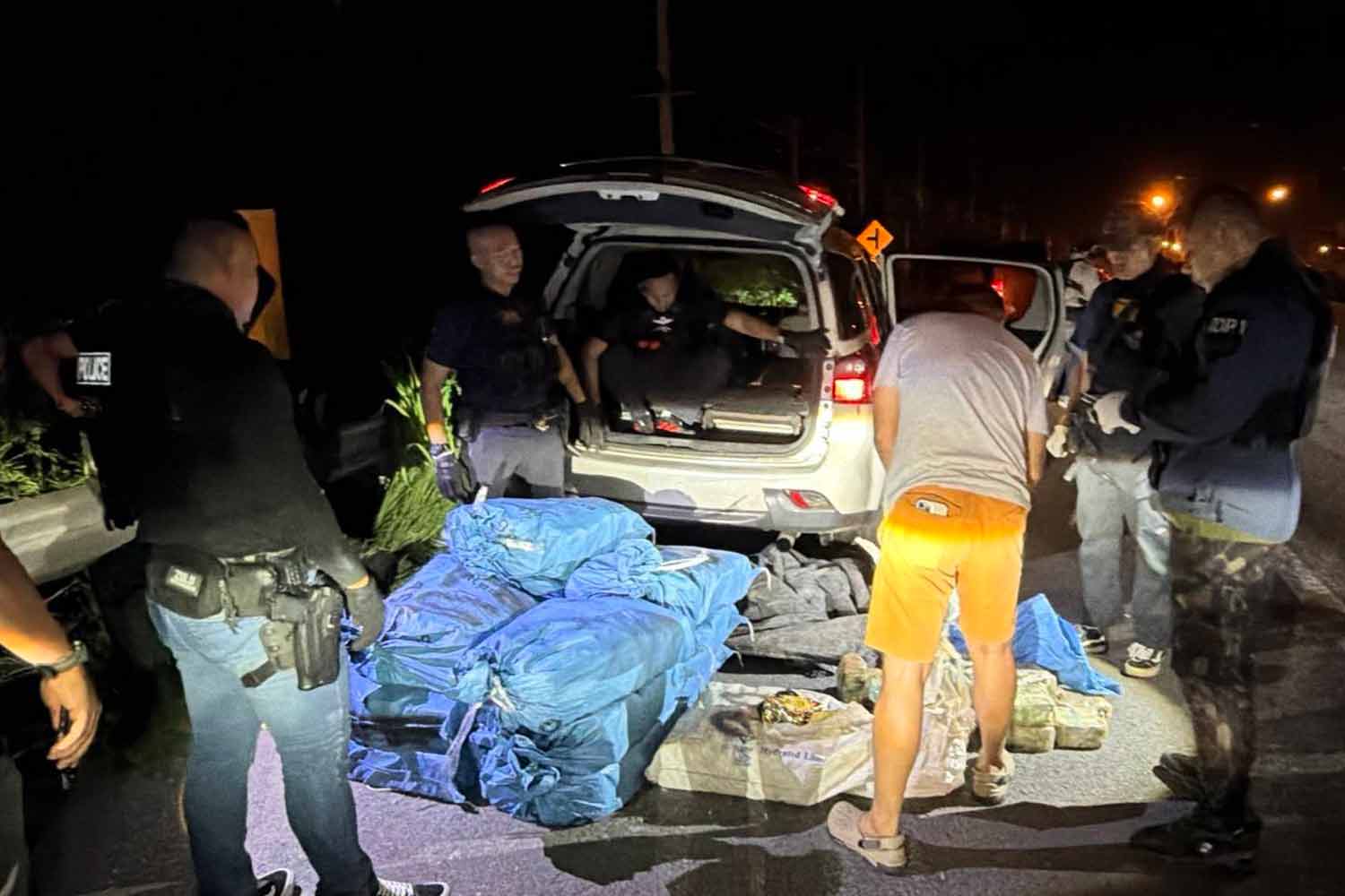Police check bags of 'ice' on the vehicle in Nakhon Sawan province on Sunday. Police photo