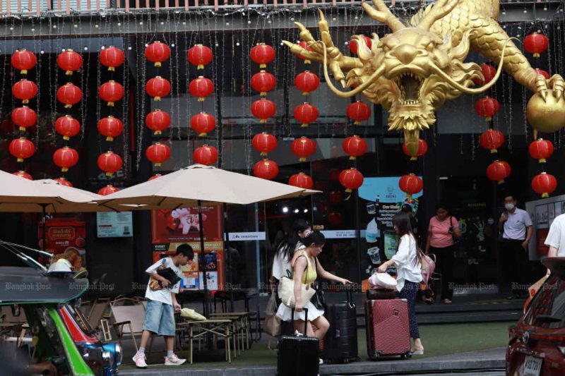 Tourists visit Yaowarat Road, in Bangkok’s Chinatown, in February. (Photo: Apichart Jinakul)