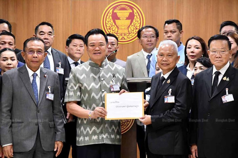 Prime Minister Anutin Charnvirakul, left, submits narcotics-related amendment bills to Speaker of the House Sophon Zaram at parliament on Wednesday. Chanat Katanyu