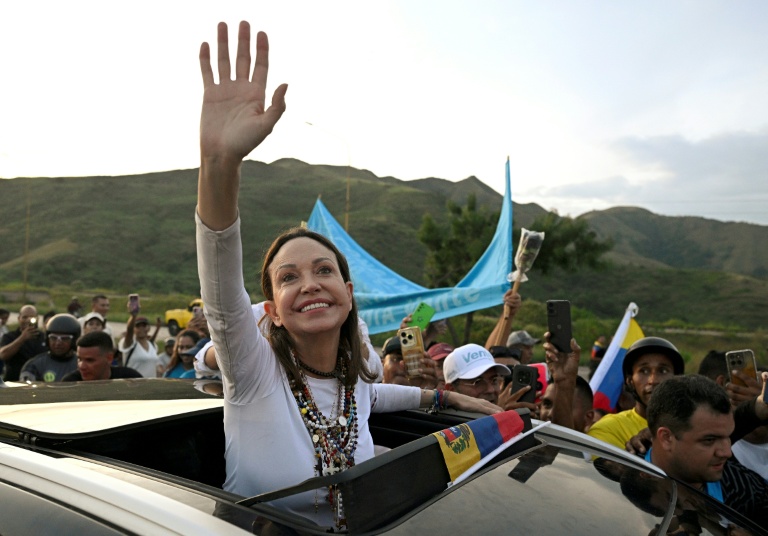 Venezuelan opposition leader and Nobel Peace Prize laureate Maria Corina Machado greets supporters after her return from exile to her homeland