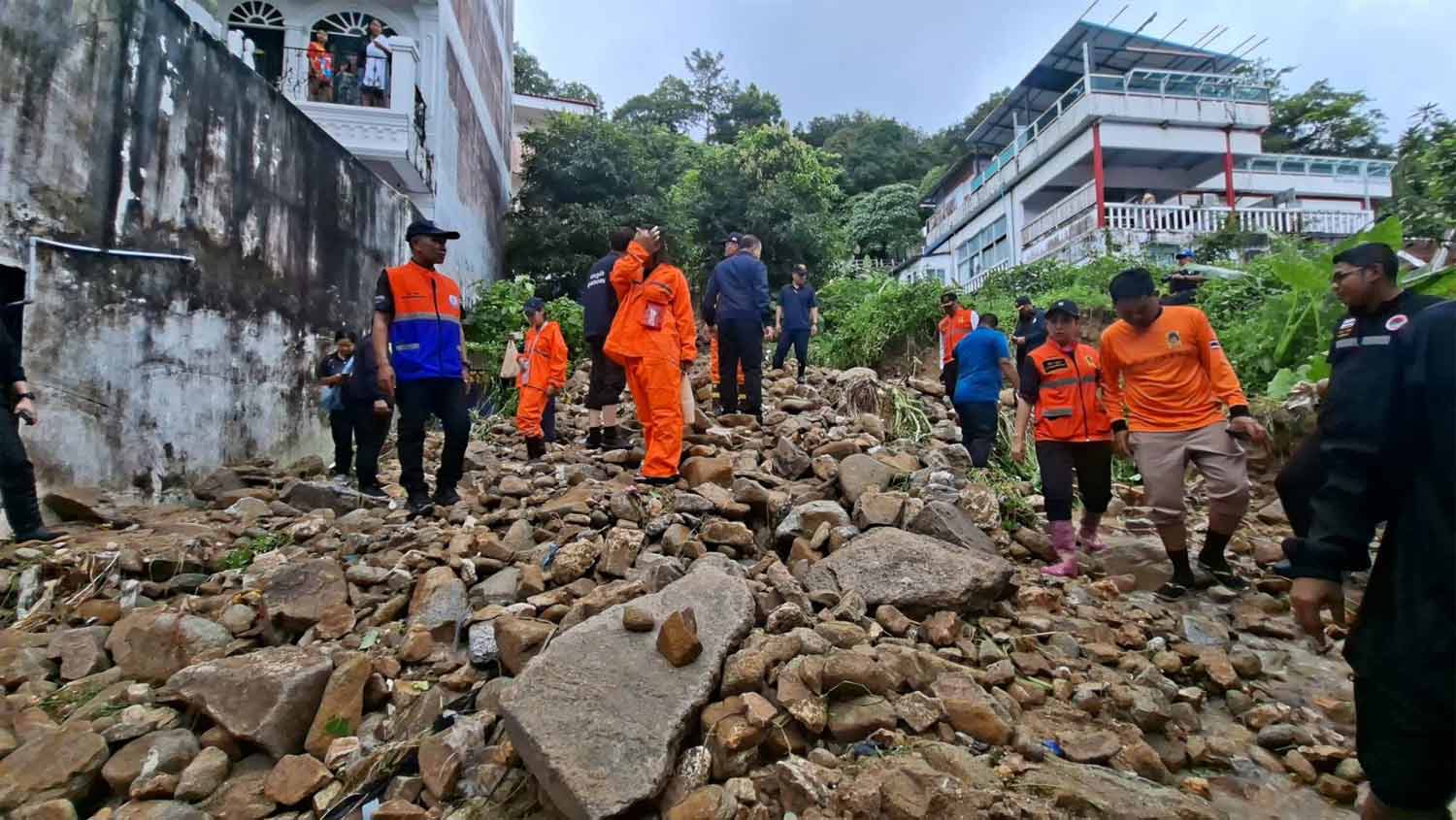 Disaster mitigation officials work at the mudslide site on Monday. (Photos supplied)
