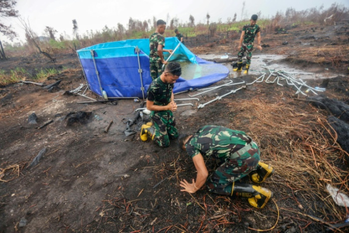 Rains bring relief to haze-weary Indonesian city - Bangkok Post