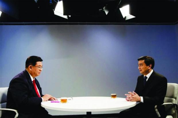 sky's the limit: Jermsak Pinthong welcomed Democrat Party leader Abhisit Vejjajiva on the 'Must Ask' programme of Fah Wan Mai channel, formerly Blue Sky.