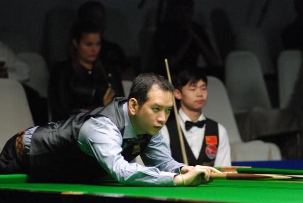 Suchakree Poomjaeng plays a shot against China's Yuan Sijun.