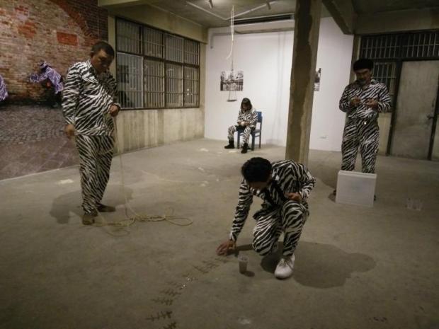 Animal kingdom: A group of artists perform in 'Zebra Project' at the Buffalo Bridge Gallery. The piece addresses Thailand's chronic corruption problem, with zebras serving as a symbol of bribery.  (Photo by Paritta Wangkiat)