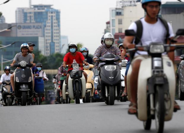 Left  As more Vietnamese acquire the means to upgrade from motorcycles to cars, the need for better roads and infrastructure will become more acute. (Photos: Reuters)