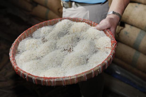 Substandard milled rice at a warehouse in Khlong Sam Wa district in Bangkok. The government is selling the rotten grain for industrial use. PATTANAPONG HIRUNARD