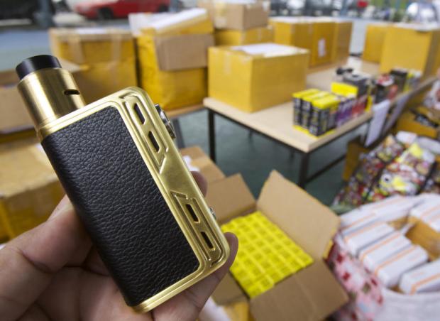 A seized electronic cigarette is presented at Bang Khen police station after two suspects were arrested with 40 e-cigarettes in Pathum Thani. Apichit Jinakul