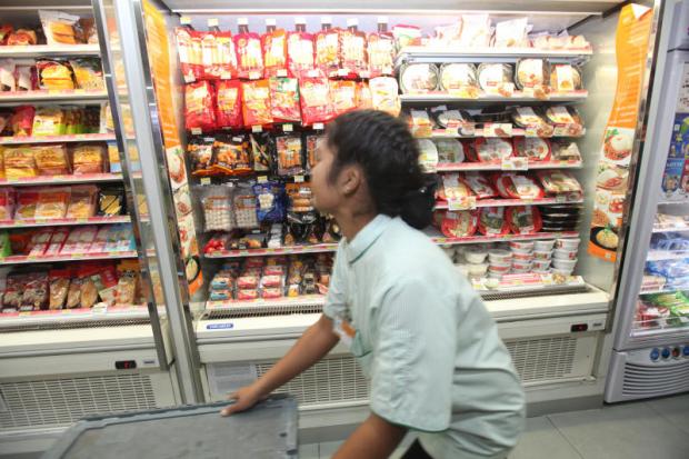 An employee working at a 7-Eleven store in Suvarnabhumi airport. SOMCHAI POOMLARD