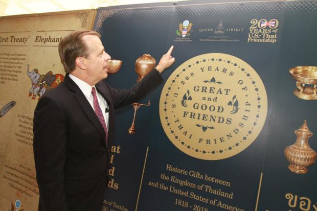 US Ambassador to Thailand Glyn T Davies points at an exhibition marking 200 years of Thai-US relations at his residence. The fair, from March 21 to June 30, will showcase gifts exchanged between the two sides' leaders for the first time. Somchai Poomlard