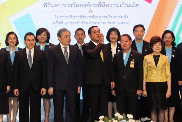 Prime Minister Prayut Chan-o-cha gestures as he presides over the 4th Fiscal Management Excellence Organisation Award at Government House yesterday. Thiti Wannamontha