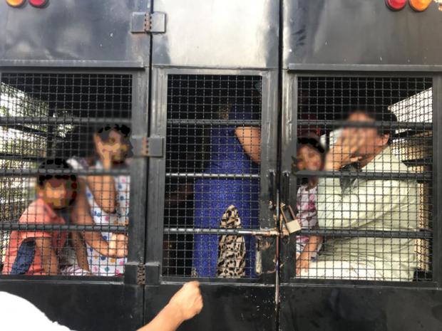 heading for an uncertain future: Members of a Pakistani Christian family getting arrested and taken to the detention centre. PHOTO: SUPPLIED/JIRACHAI A.