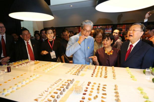 Deputy Prime Minister Somkid Jatusripitak eats a snack displayed at ThaiFex: World of Food Asia 2018. KITJA APICHONROJAREK