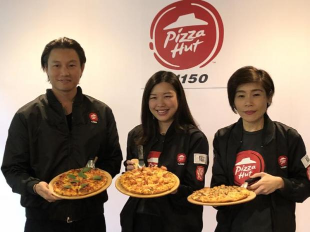 From left Chalermchai Mahagitsiri, president and chief executive of Thoresen Thai Agencies Plc; Ausana Mahagitsiri, director of PH Capital Co, the operator of Pizza Hut in Thailand; and Vorawan Phianlikhitwong, general manager of PH Capital.