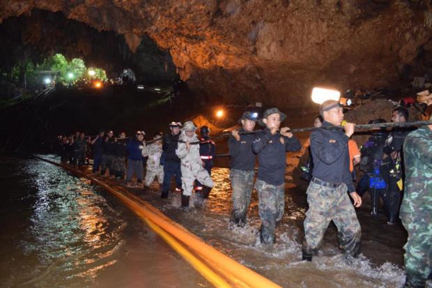 Army personnel and volunteers help install a power line at Tham Luang cave. Photo courtesy of Royal Thai Army