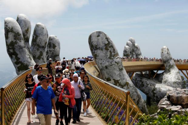 Golden Bridge Draws Visitors To Vietnam S Ba Na Hills