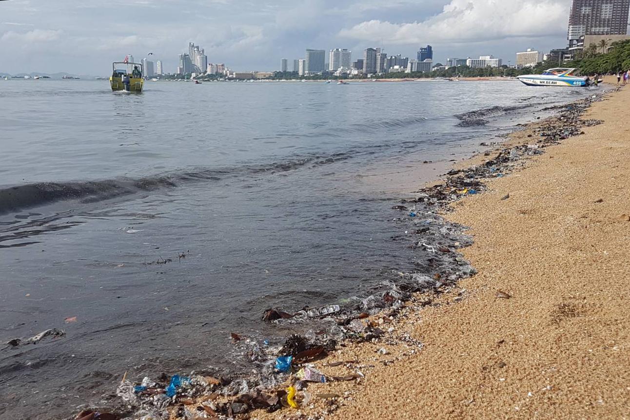 Filthy water laps against a beach in South Pattaya near the entrance to the Walking Street behind the city's water treatment facility in May. Authorities say the treatment system becomes overwhelmed during heavy rains, but it's also been reported that many parts of the system have just broken down. (Photo: Chaiyot Phupattanapong)