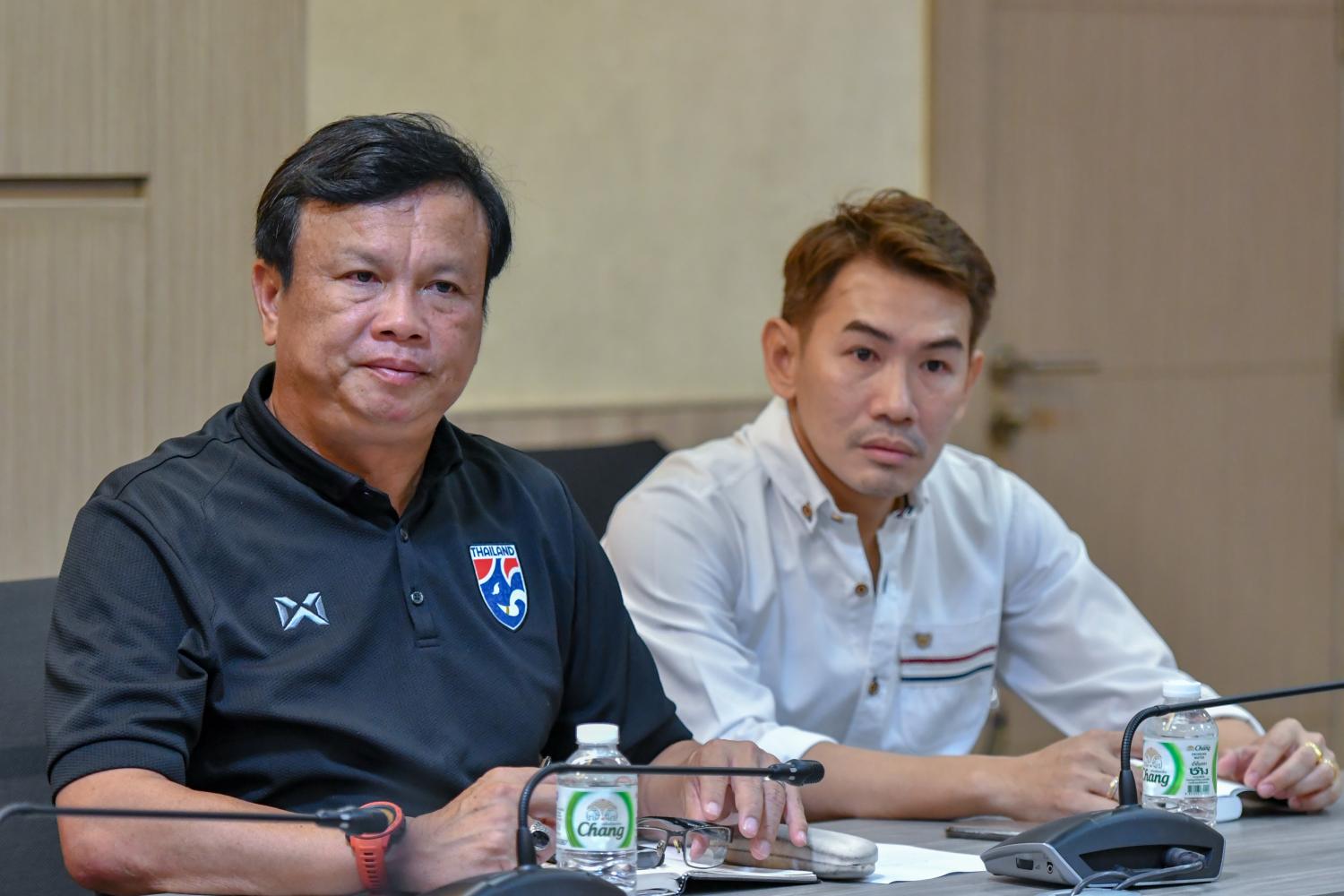 Sirisak Yodyardthai, left, and Anurak Srikerd at Tuesday's meeting.