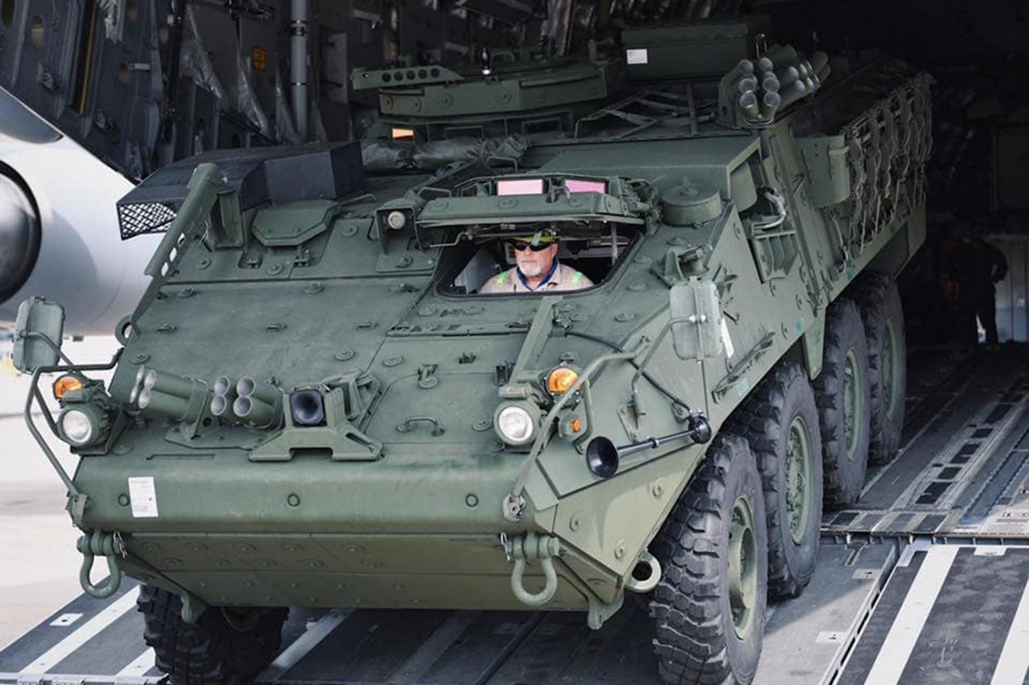 The first two in a batch of 60 US-made M1126 Stryker infantry carriers arrive yesterday at the Royal Thai Air Force's base in Bangkok's Don Muang district. The Defence Ministry purchased the refurbished troop carriers to modernise the 11th Infantry Division. (Photo courtesy of 'SMART Soldiers Strong ARMY' Facebook page)