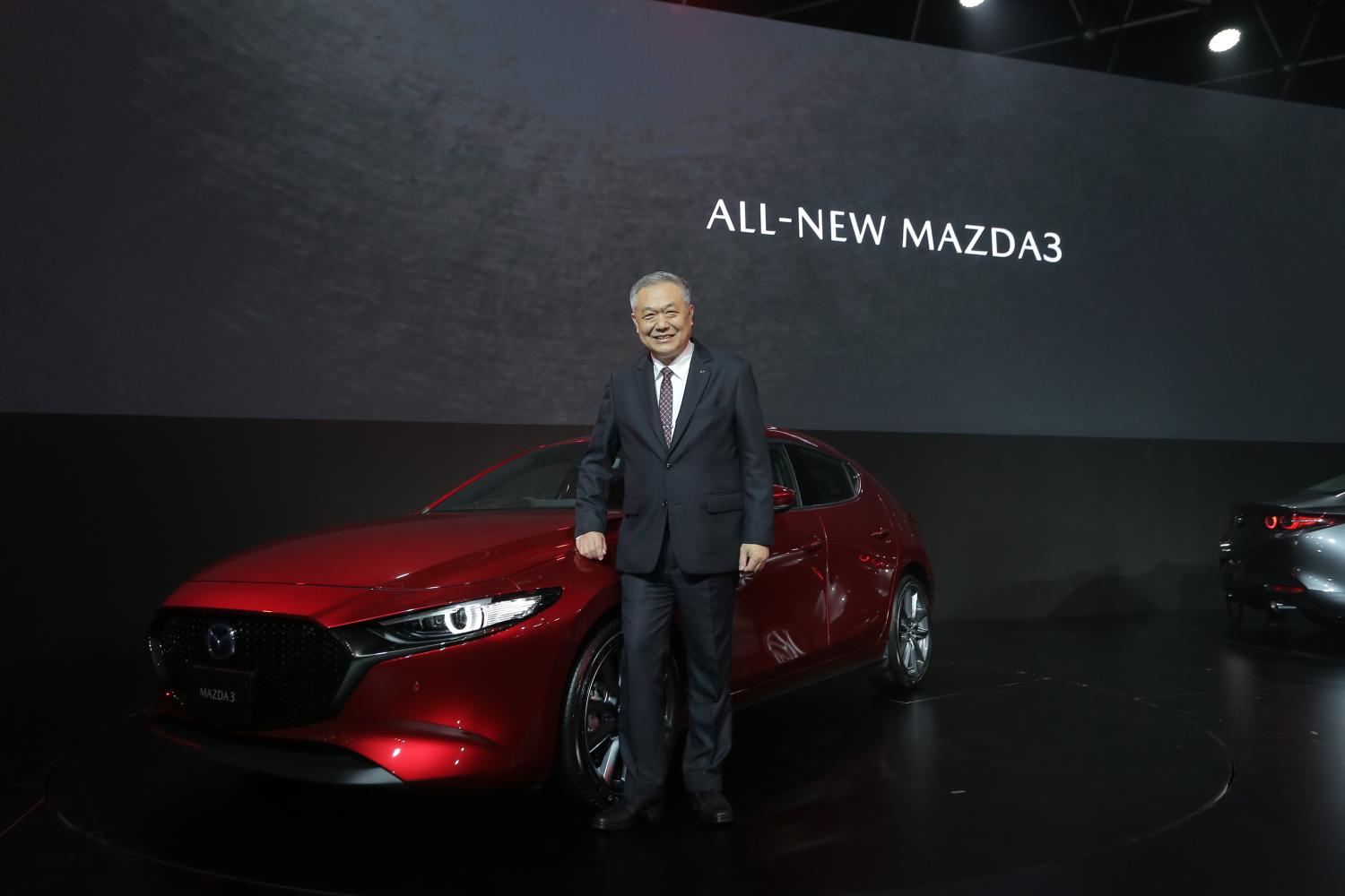 Mazda trims forecast as economy buckles under pressure