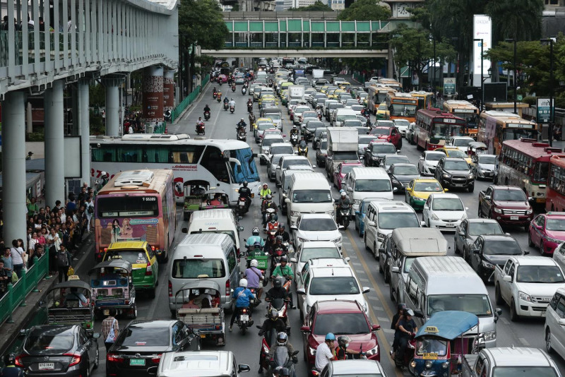 Motorbikes weaving through Bangkok traffic — Thailand's road fatality rate is nearly triple the US rate, making this the top risk for foreigners