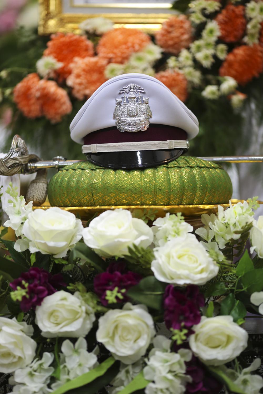 Final farewell: The hat of a police officer who took his own life is placed on a tray in his honour.