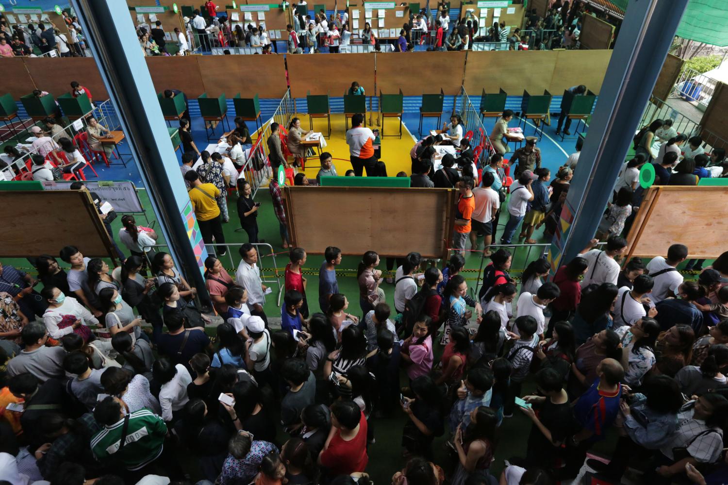 Exercising their ballot: People turn up to cast their vote during advance voting ahead of the March 24 general election at Matthayom Ban Bang Kapi School in Bang Kapi district.