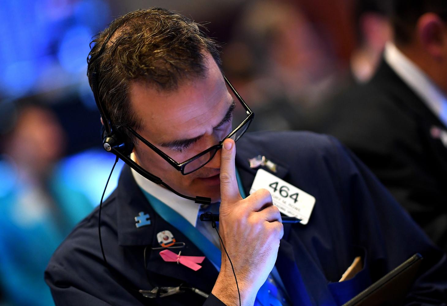 Traders work during the opening bell at the New York Stock Exchange on Monday on Wall Street in New York City. AFP Traders work during the opening bell at the New York Stock Exchange on Monday on Wall Street in New York City. AFP