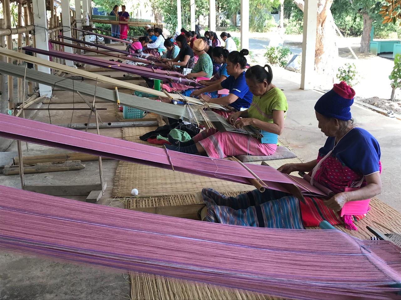 The villagers of Ban Phra Bat Huai Tom in Lamphun province weave cloth in their free time for the village's Otop shop. Karnjana Karnjanatawe