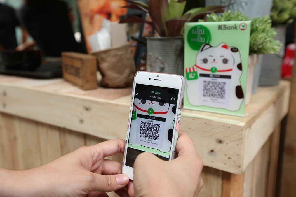 The K Plus app scans a barcode for payment. Banks have developed QR code payments that can be used in different countries.