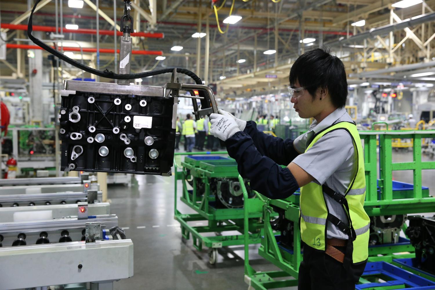 A worker at GM's production line in Rayong. The US car maker will lay off 1,500 employees with severance pay.