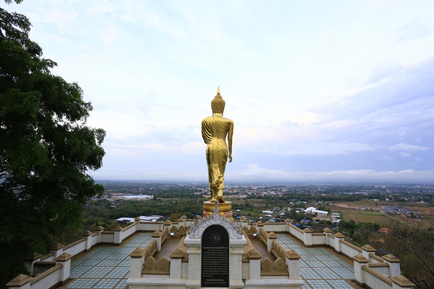 A standing Buddha statue at Wat Phrathat Khao Noi overlooks Muang district in Nan. SUPPLIED