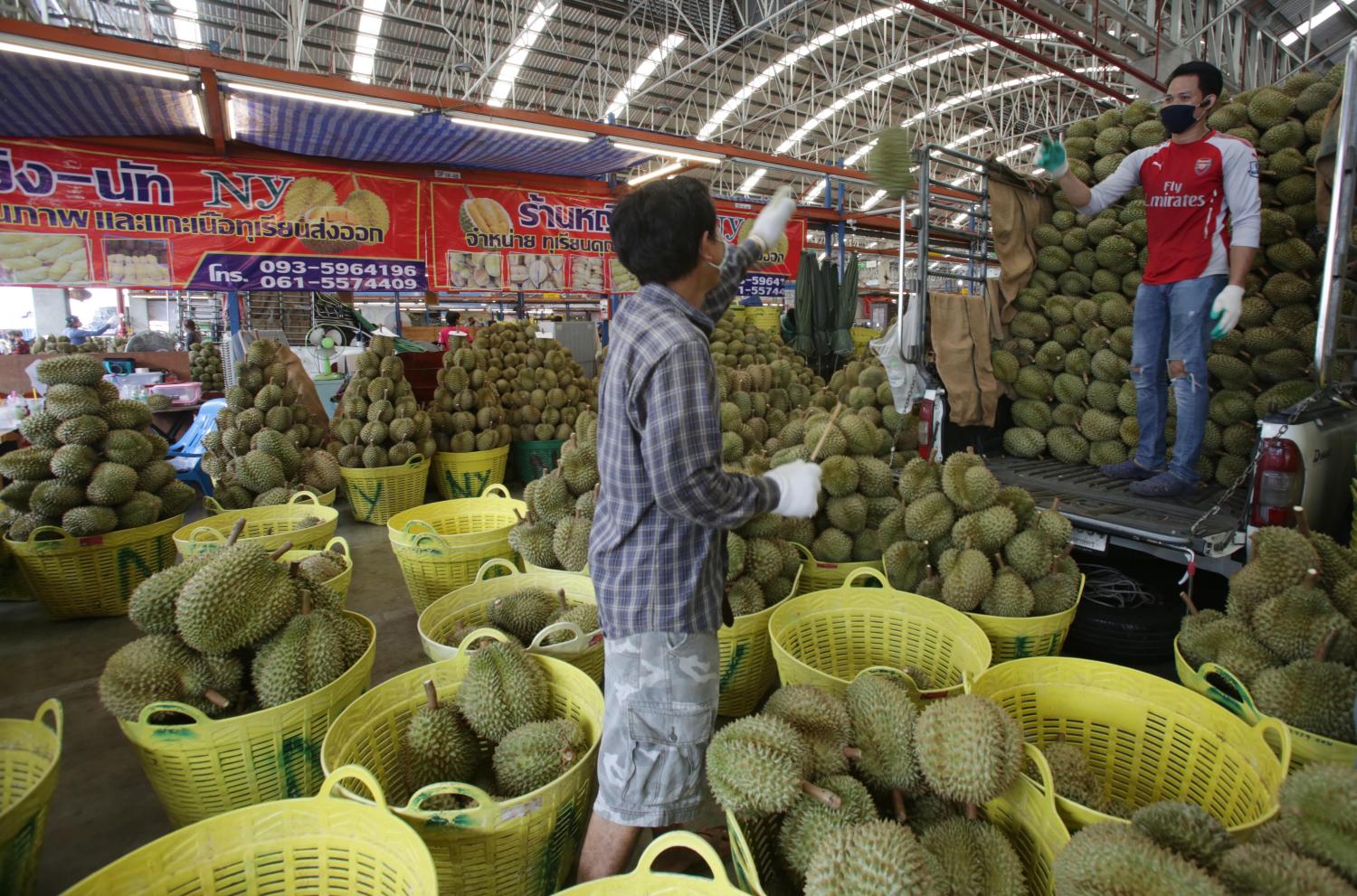 Fresh durian is loaded into a Thong Fah mobile fruit store. There are 350 such stores across Bangkok.