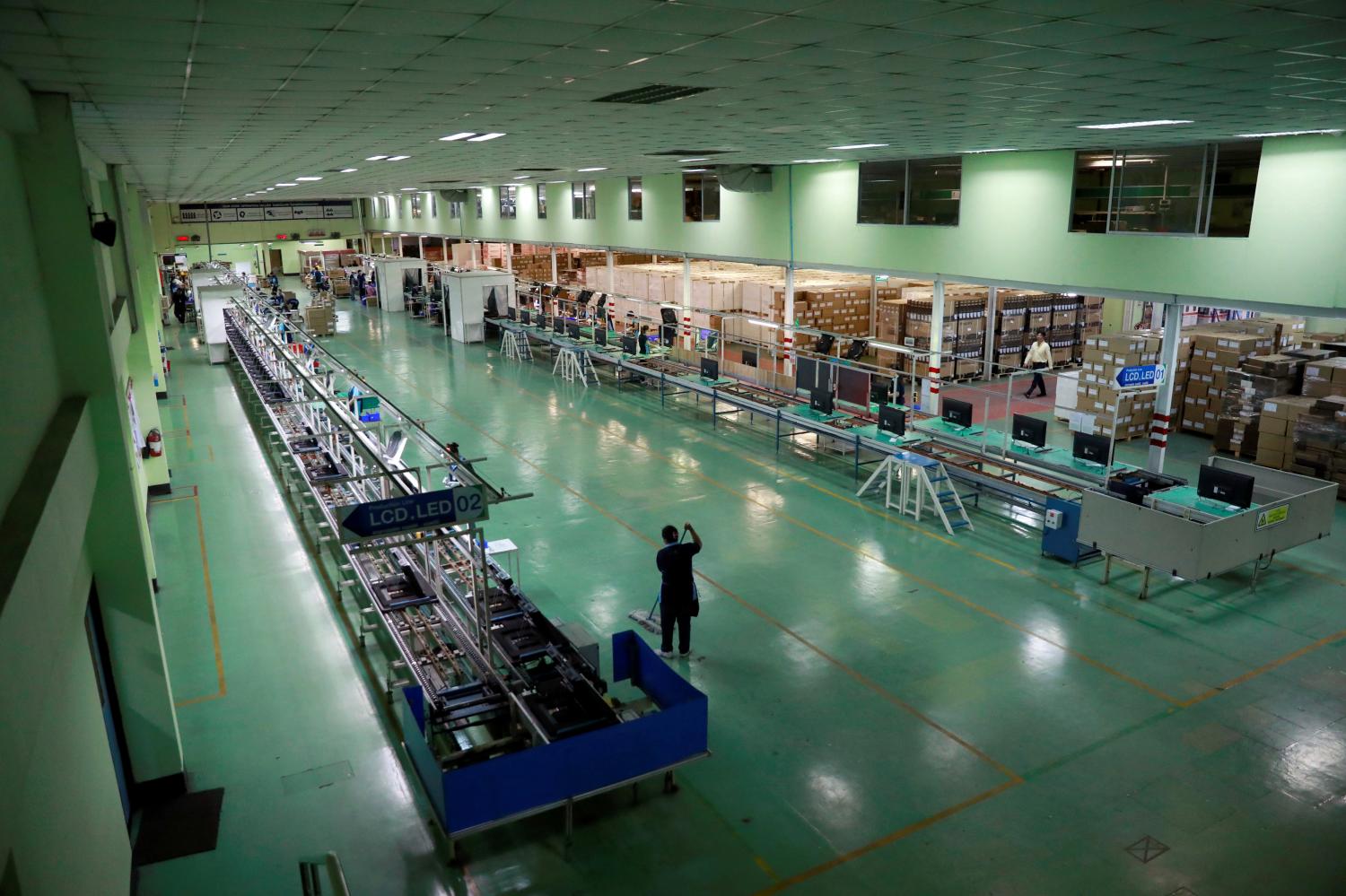 A TV assembly line is virtually abandoned in Bangkok as the OIE downgrades to MPI to as low as -7%. REUTERS