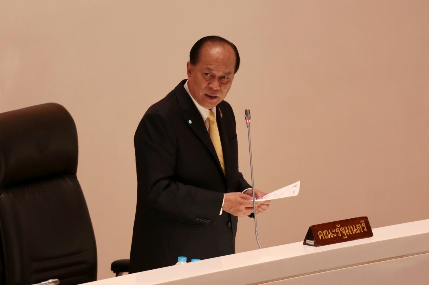 Interior Minister Anupong Paojinda defends the 1.8-billion-baht procurement of two helicopters by the Department of Disaster Prevention and Mitigation for use in combating bush-fires during the first reading of the 2021 Budget Bill. (Photo by Chanat Katanyu)