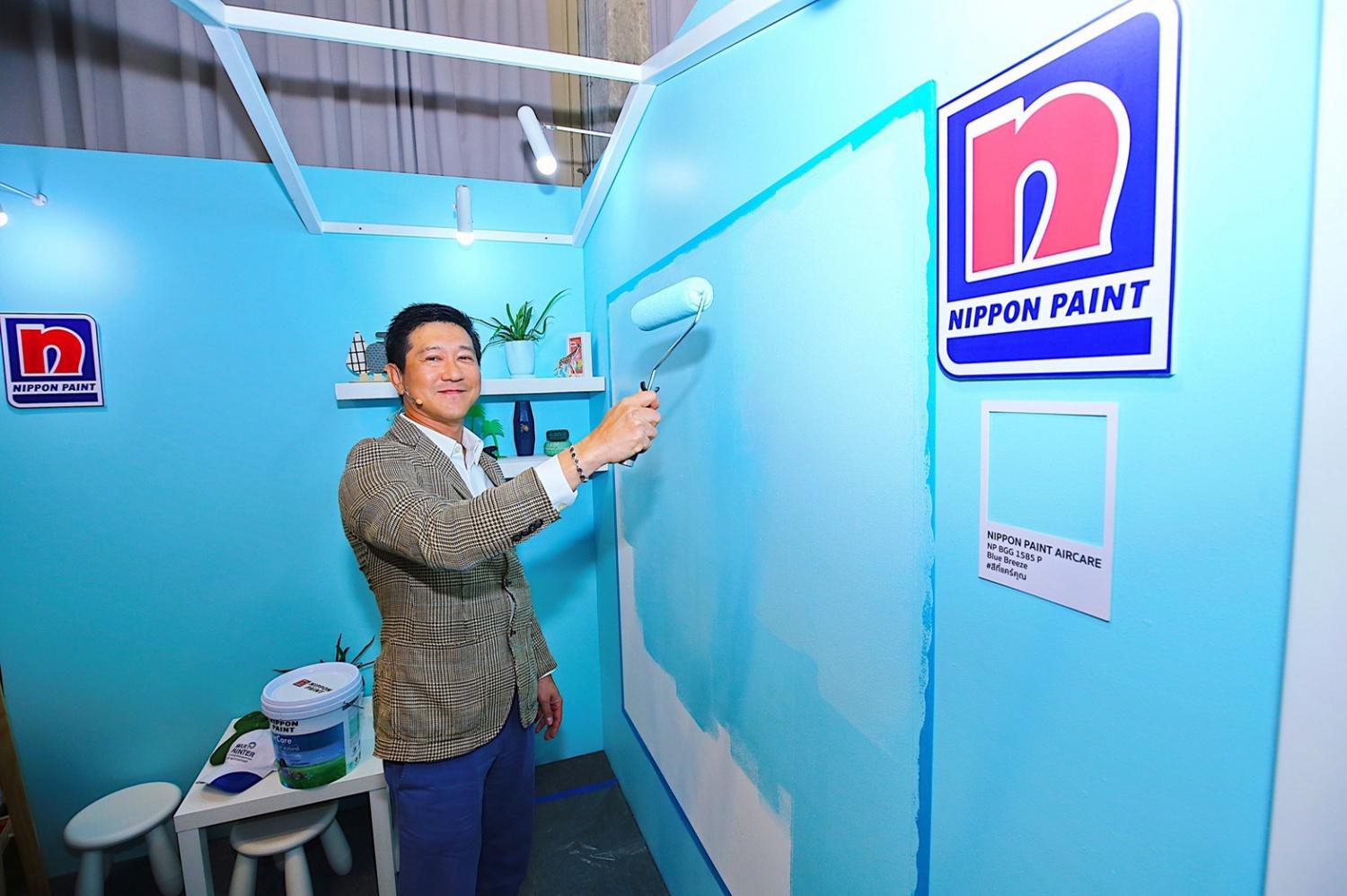 Mr Watchara promotes a new line of paint that purports to be antibacterial and antiviral.