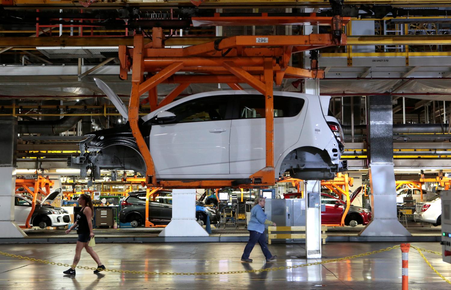 A partially assembled 2017 Chevrolet Bolt EV is on the assembly line at GM's assembly plant in Orion. The company said it would spend $27 billion through 2025 to develop EVs and driverless vehicles. A partially assembled 2017 Chevrolet Bolt EV is on the assembly line at GM's assembly plant in Orion. The company said it would spend $27 billion through 2025 to develop EVs and driverless vehicles.
