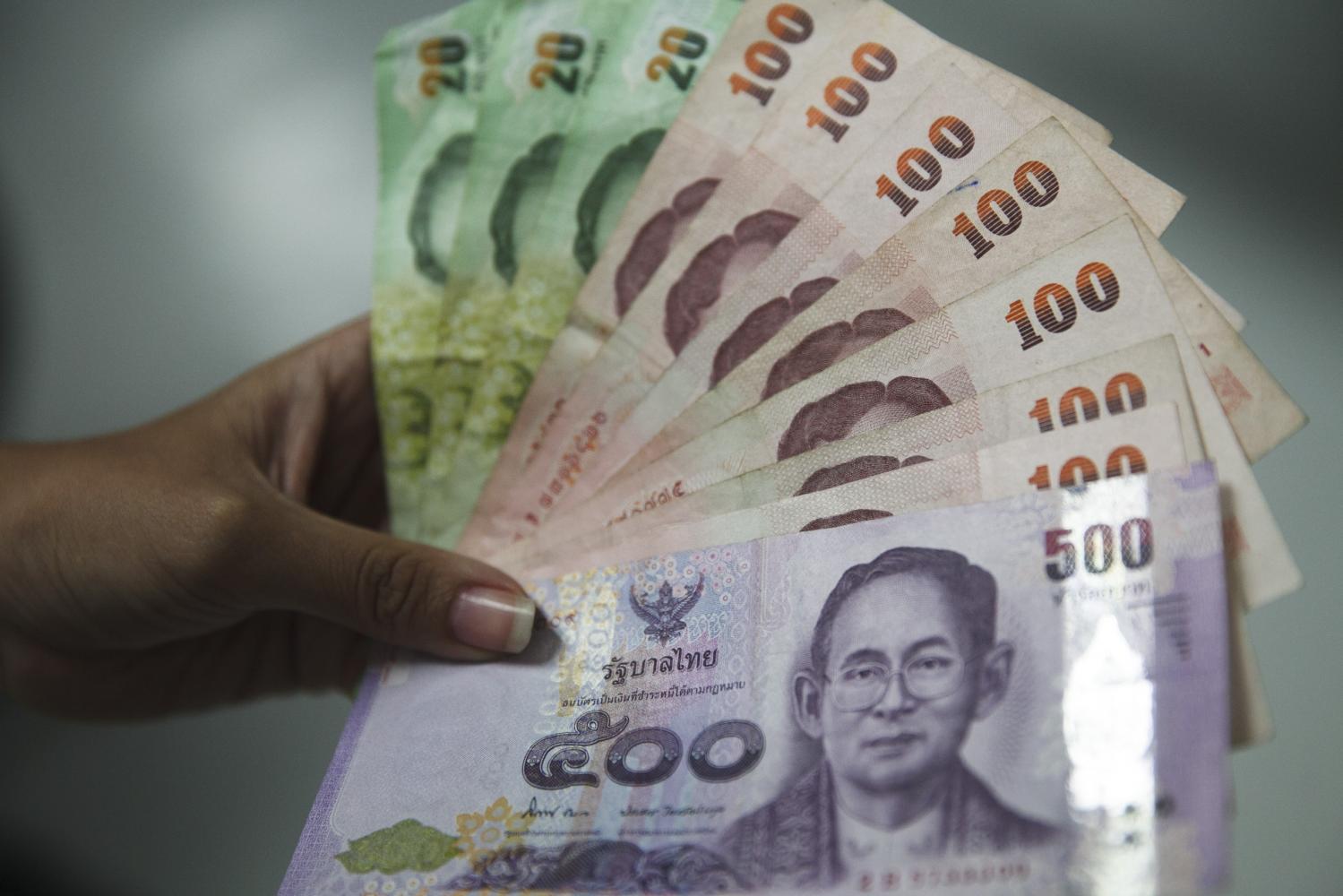 The baht reached a 10-month high against the dollar in November. Seksan Rojjanametakul