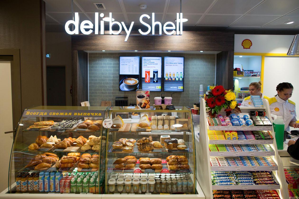 Customers are served in a 'Deli by Shell' store in Kemerovo, Russia. BLOOMBERG Customers are served in a 'Deli by Shell' store in Kemerovo, Russia. BLOOMBERG