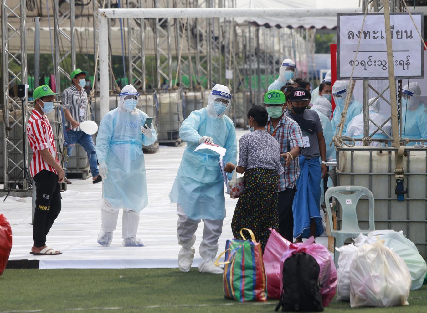 Free to leave: Myanmar workers in Samut Sakhon are released from a field hospital after recovering from Covid-19.