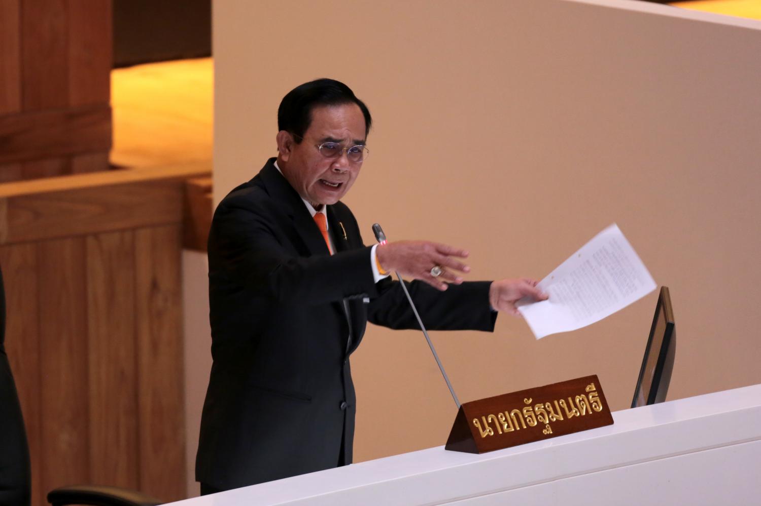 Prime Minister Prayut Chan-o-cha counters opposition criticism on the second day of the censure debate, which touched on the government's Covid record, arms procurement schemes and the closure of a goldmine in Phichit. Photos by Chanat Katanyu