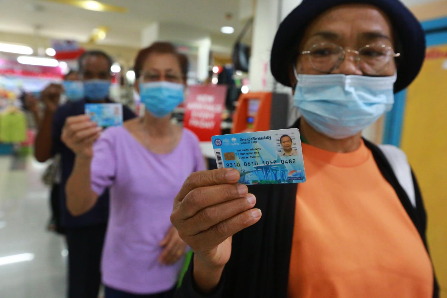 State welfare cardholders make purchases under the We Win scheme at the Infinite Mall in Samut Prakan.