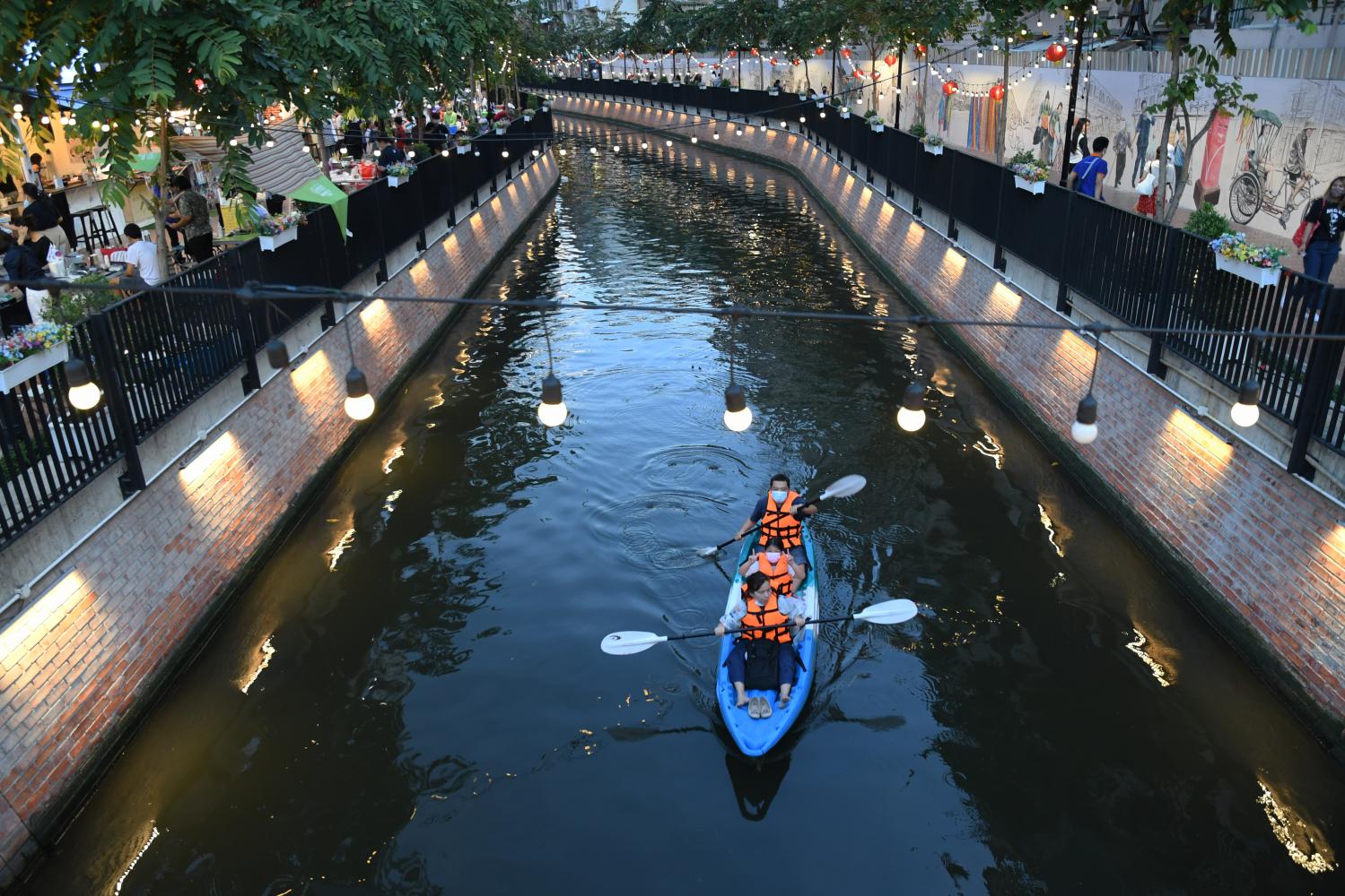 spruced up: A family goes kayaking in Klong Ong Ang in the central Bangkok district of Phra Nakhon. The historical canal has been cleaned and its banks given a facelift to attract visitors.