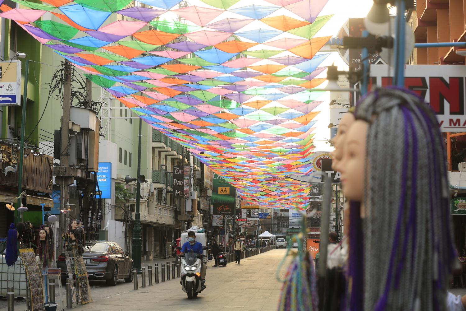 A motorbike passes through an almost empty Khao San Road during the Songkran holidays.