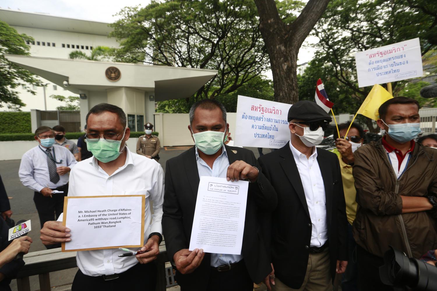 Rally outside embassy tells US to 'stop interfering'