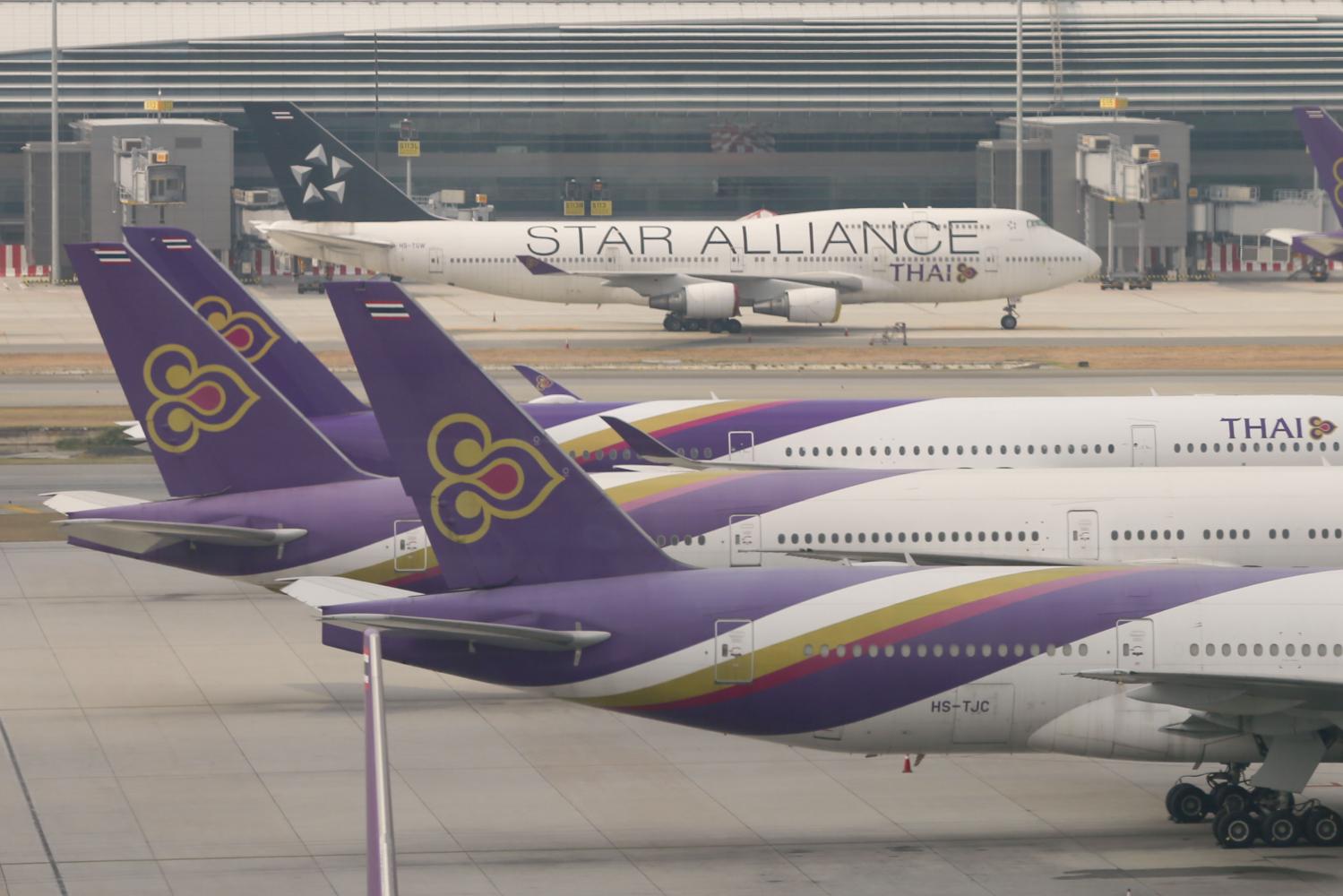 Aircraft of Thai Airways are parked at Suvarnabhumi airport due to travel restrictions to curb the spread of the covid pandemic. (Photo by Arnun Chonmahatrakool)