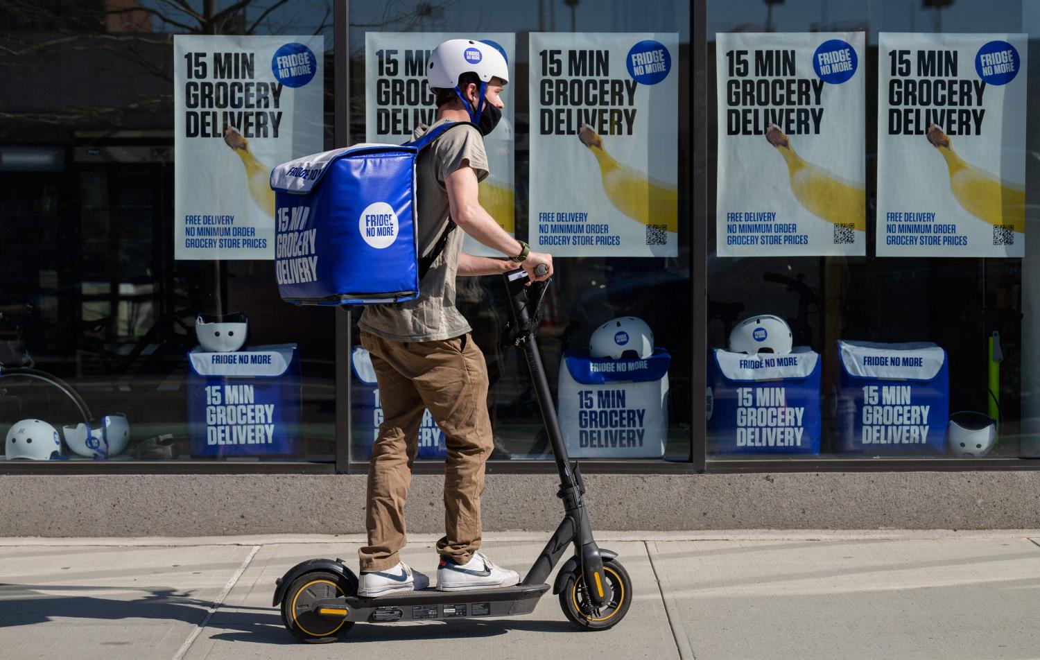 An employee rides a scooter to deliver groceries from 'Fridge No More' in the Brooklyn borough of New York City. (Photo: AFP) An employee rides a scooter to deliver groceries from 'Fridge No More' in the Brooklyn borough of New York City. (Photo: AFP)