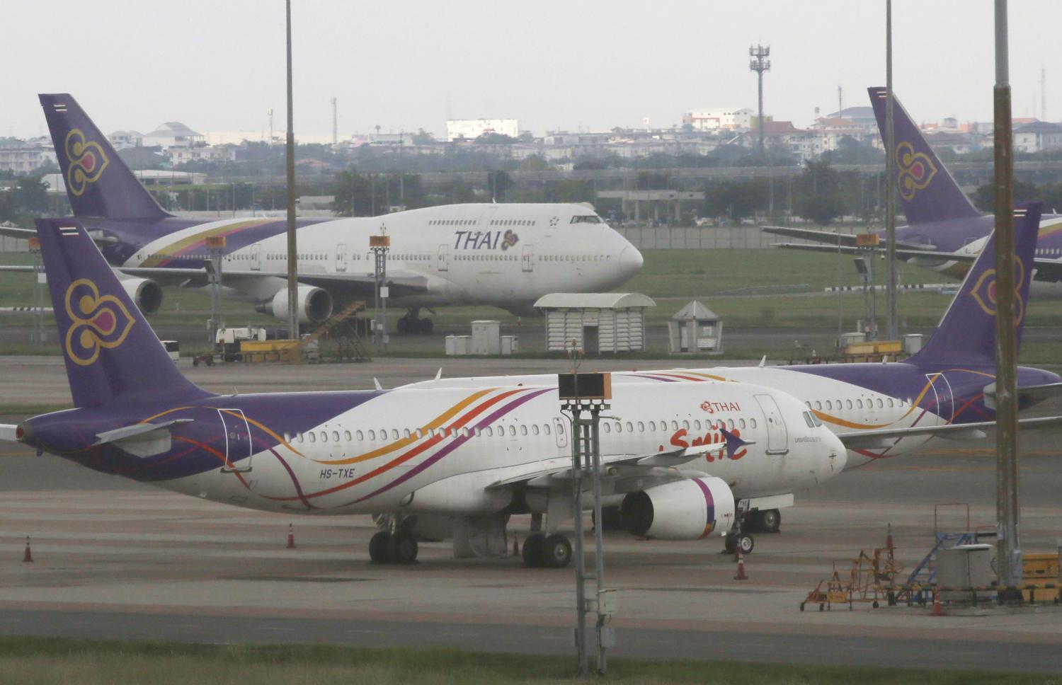 Thai Airways aircraft remain grounded at Suvarnabhumi airport as the airline's creditors vote on Wednesday whether to accept its debt rehabilitation plan. (Photo by Apichit Jinakul)